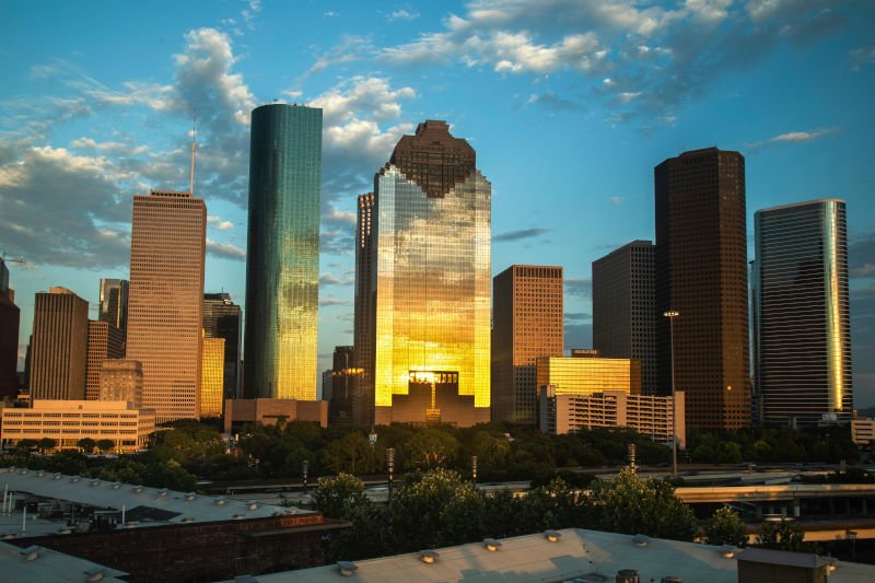 City skyline of Houston, Texas at sunset used for Houston dumpster rental directory card